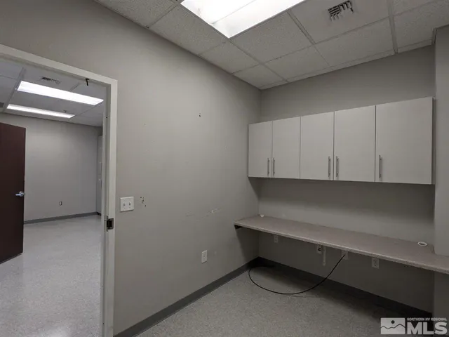 a room with a closet and cabinets