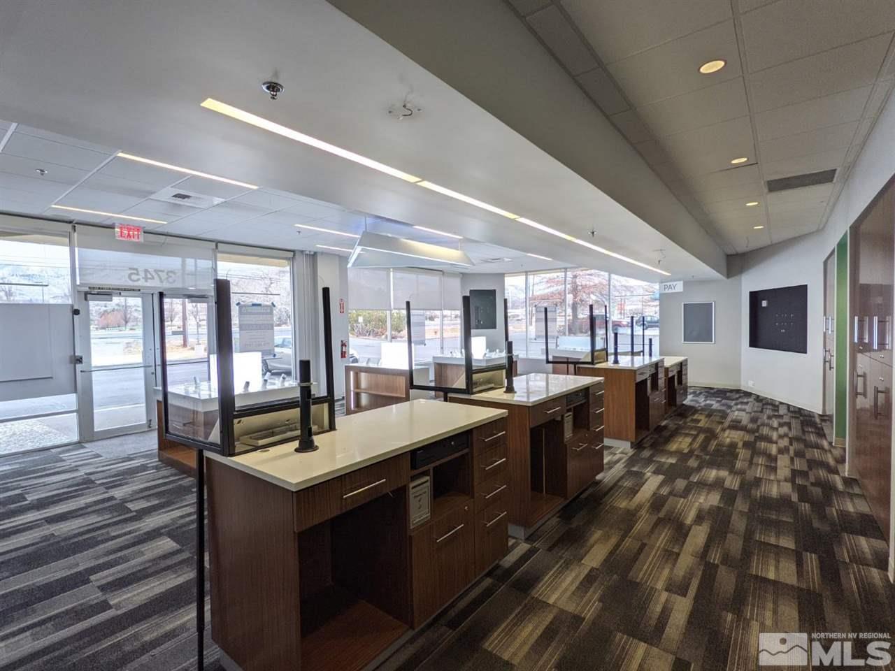 3745 North Carson Street, Unit 3745 Carson City, NV 89706 - Photo 27 of 33 a large kitchen with kitchen island a sink stainless steel appliances and cabinets