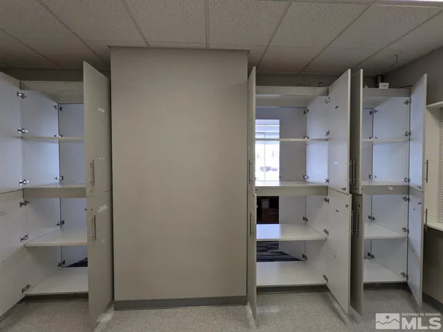 a front view of a building with a glass windows