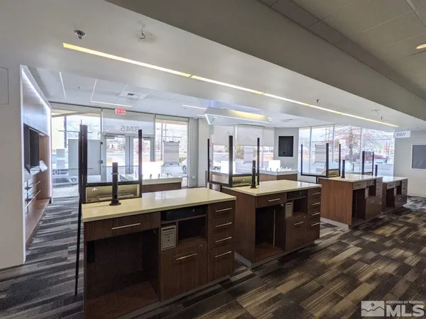 a large kitchen with lots of counter space and a sink