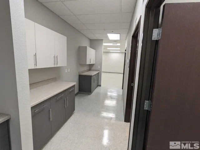 a kitchen with stainless steel appliances a refrigerator and a sink