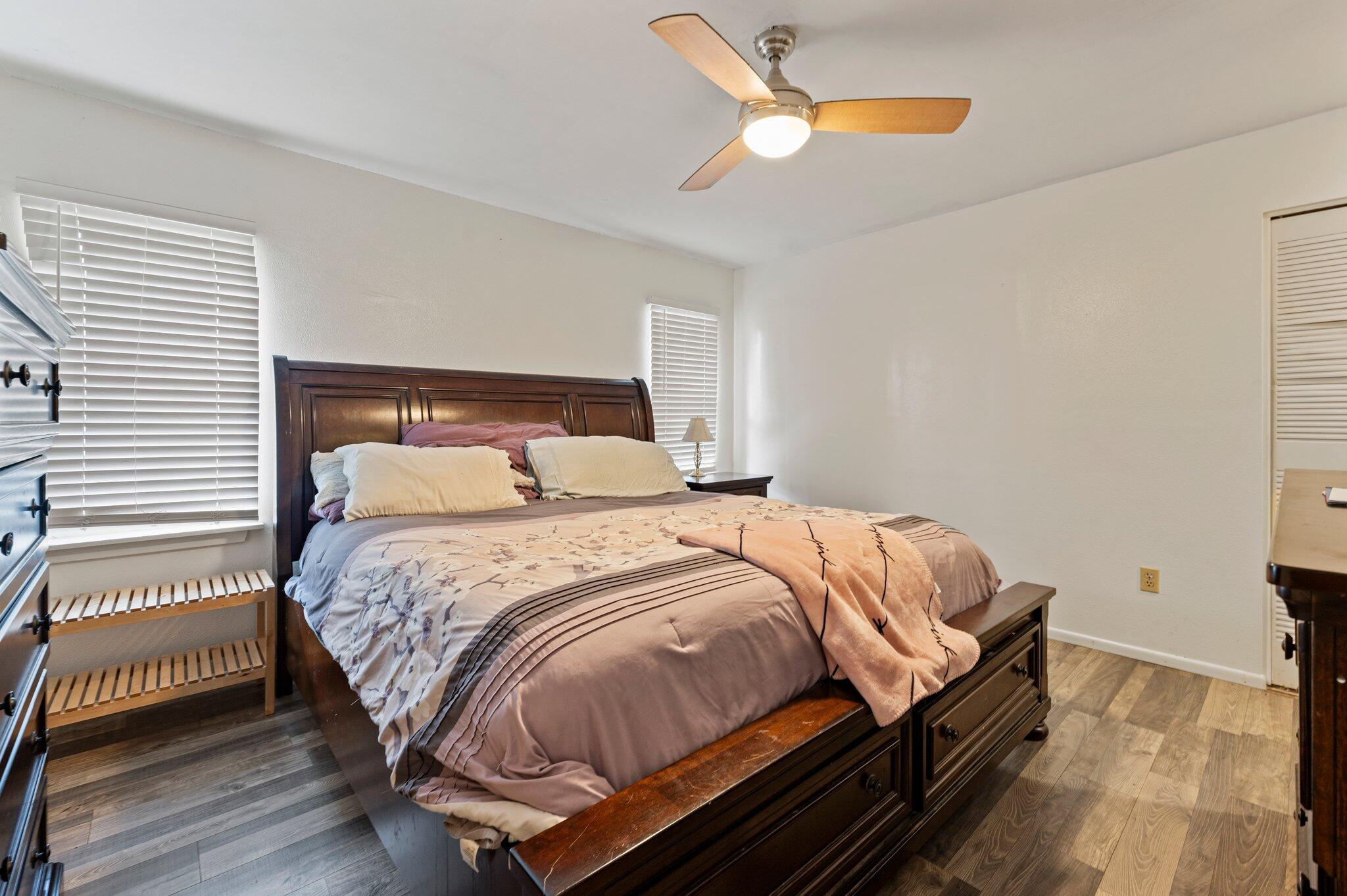 822 Onyx Drive Northeast Palm Bay, FL 32905 - Photo 14 of 21 a bedroom with a bed and a cabinets