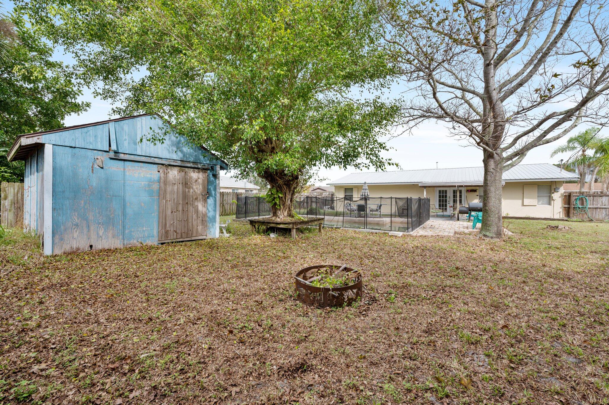 822 Onyx Drive Northeast Palm Bay, FL 32905 - Photo 18 of 21 a front view of a house with garden