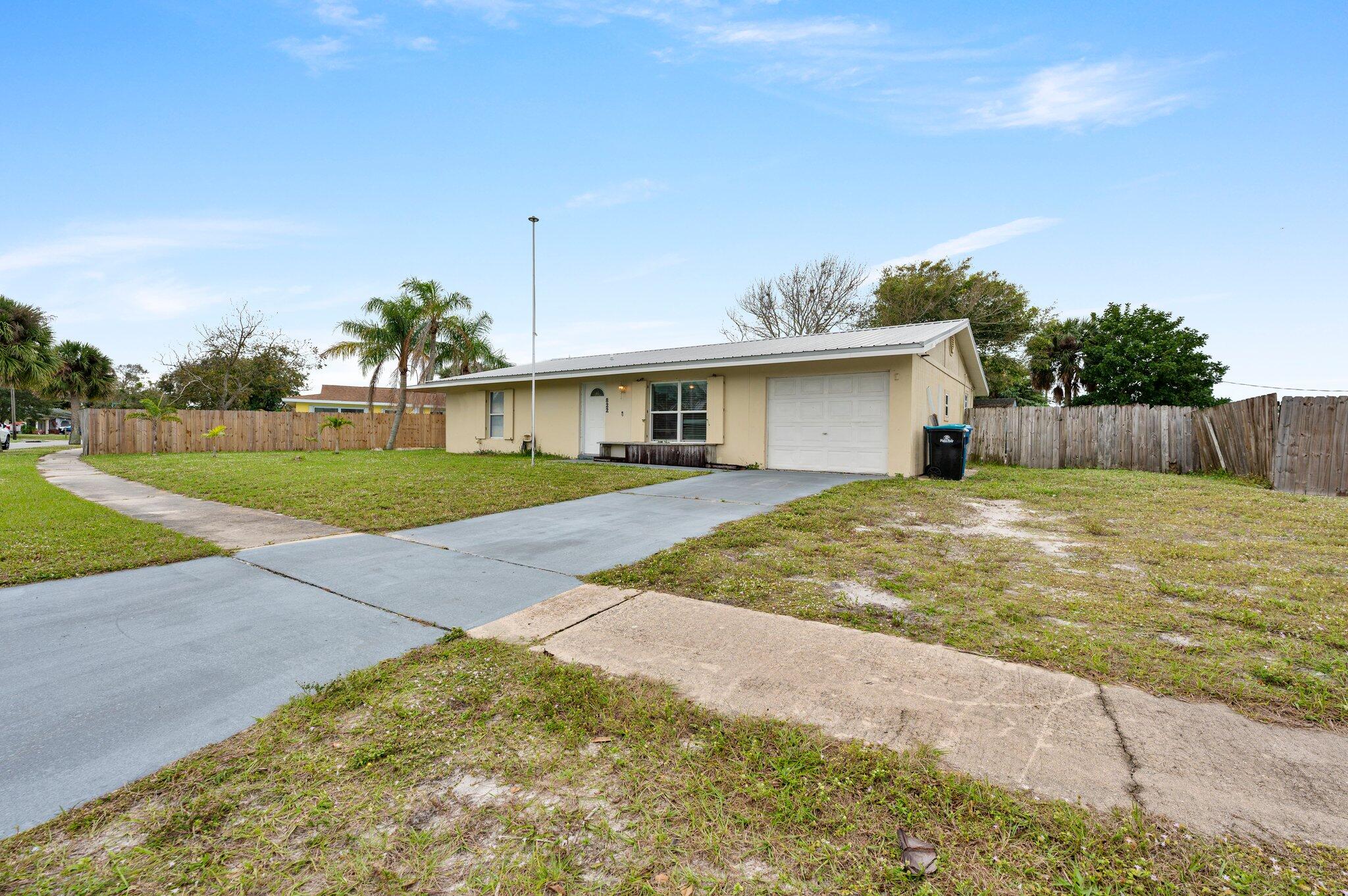 822 Onyx Drive Northeast Palm Bay, FL 32905 - Photo 20 of 21 a house view with a outdoor space