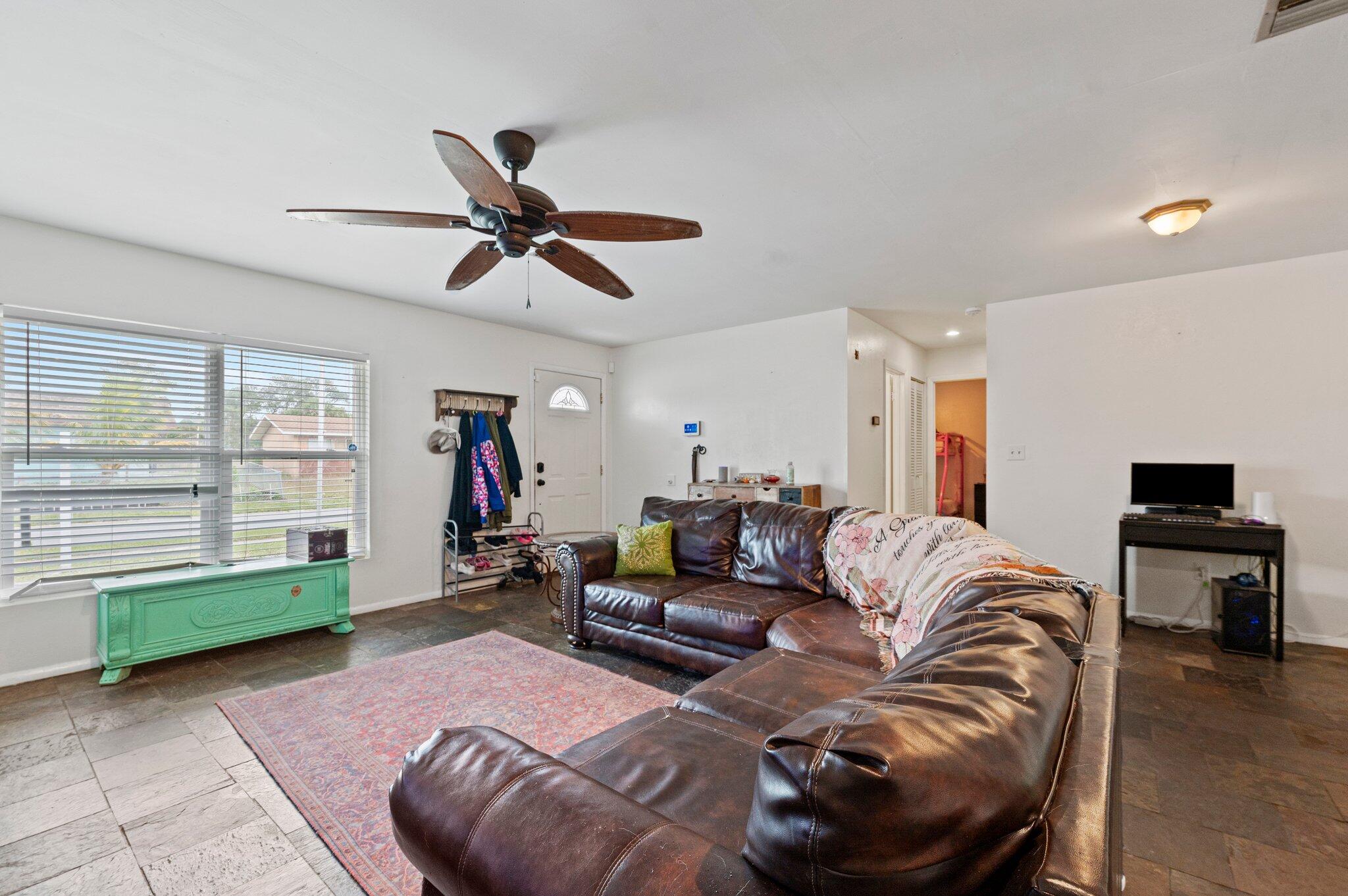 822 Onyx Drive Northeast Palm Bay, FL 32905 - Photo 5 of 21 a living room with furniture and a window