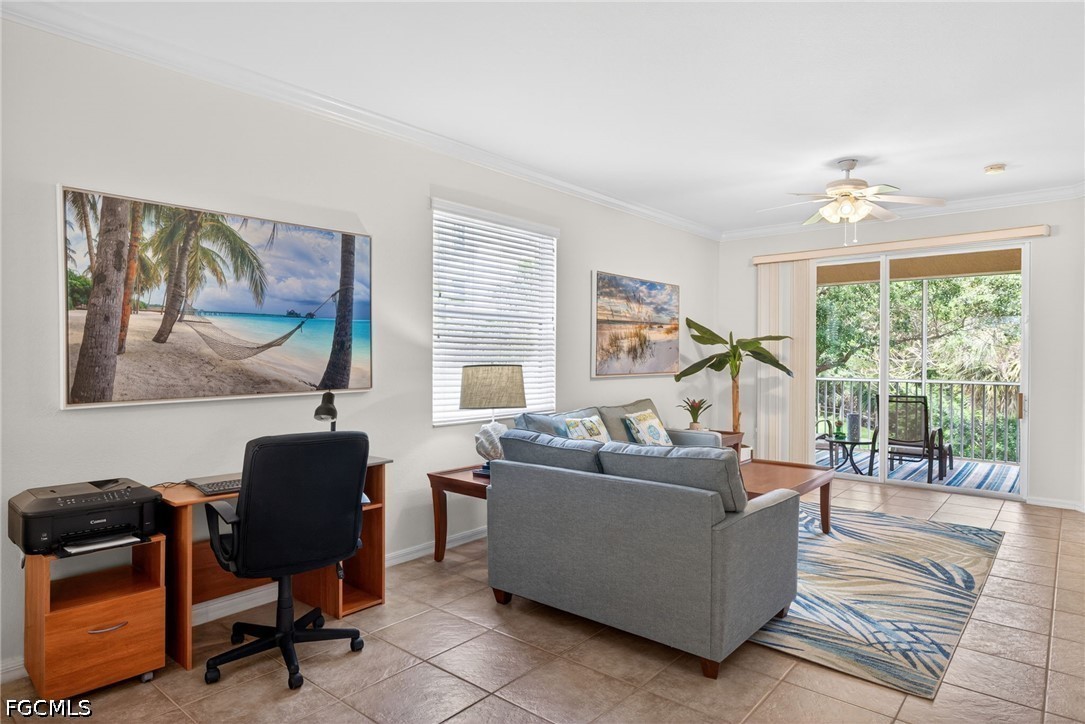 8251 Pathfinder Loop, Unit 621 Fort Myers, FL 33919 - Photo 10 of 30 a living room with furniture and a large window