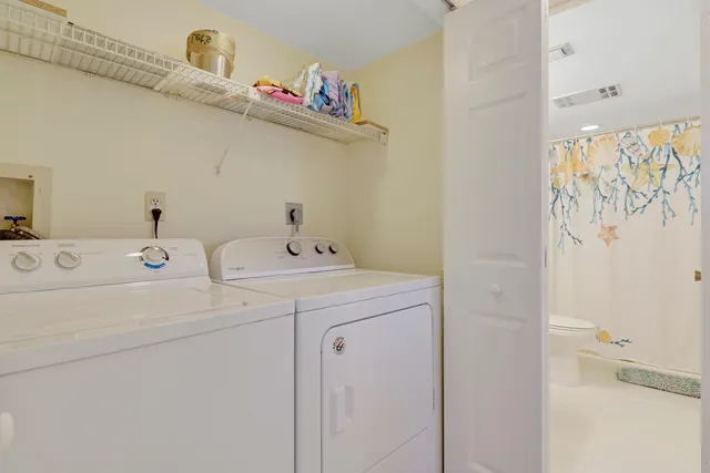 a view of a porch with furniture and a yard