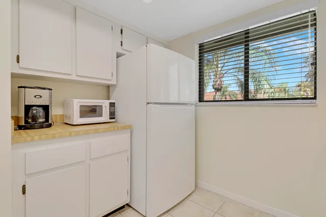 a kitchen with granite countertop cabinets and steel stainless steel appliances