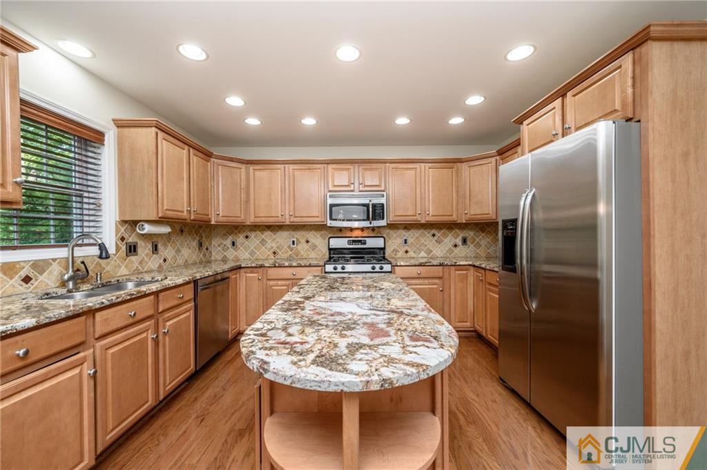 20 Blue Jay Hill Road Westampton, NJ 08060 - Photo 14 of 65 a kitchen with stainless steel appliances granite countertop a refrigerator sink stove microwave and cabinets