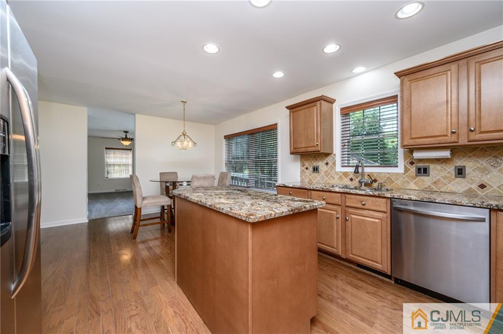 20 Blue Jay Hill Road Westampton, NJ 08060 - Photo 16 of 65 a kitchen with granite countertop a sink stove and refrigerator