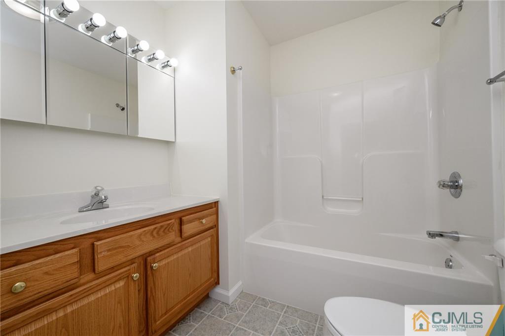 20 Blue Jay Hill Road Westampton, NJ 08060 - Photo 32 of 65 a bathroom with a tub shower vanity and a sink