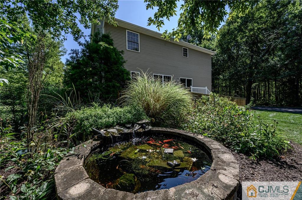 20 Blue Jay Hill Road Westampton, NJ 08060 - Photo 46 of 65 a view of a backyard with potted plants