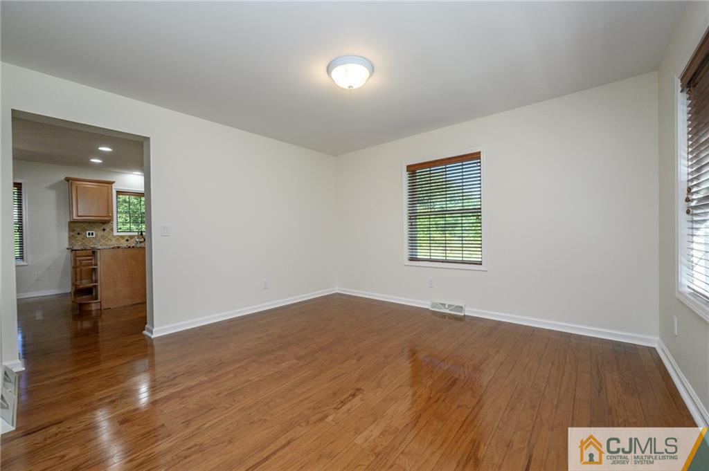 20 Blue Jay Hill Road Westampton, NJ 08060 - Photo 8 of 65 an empty room with wooden floor and windows