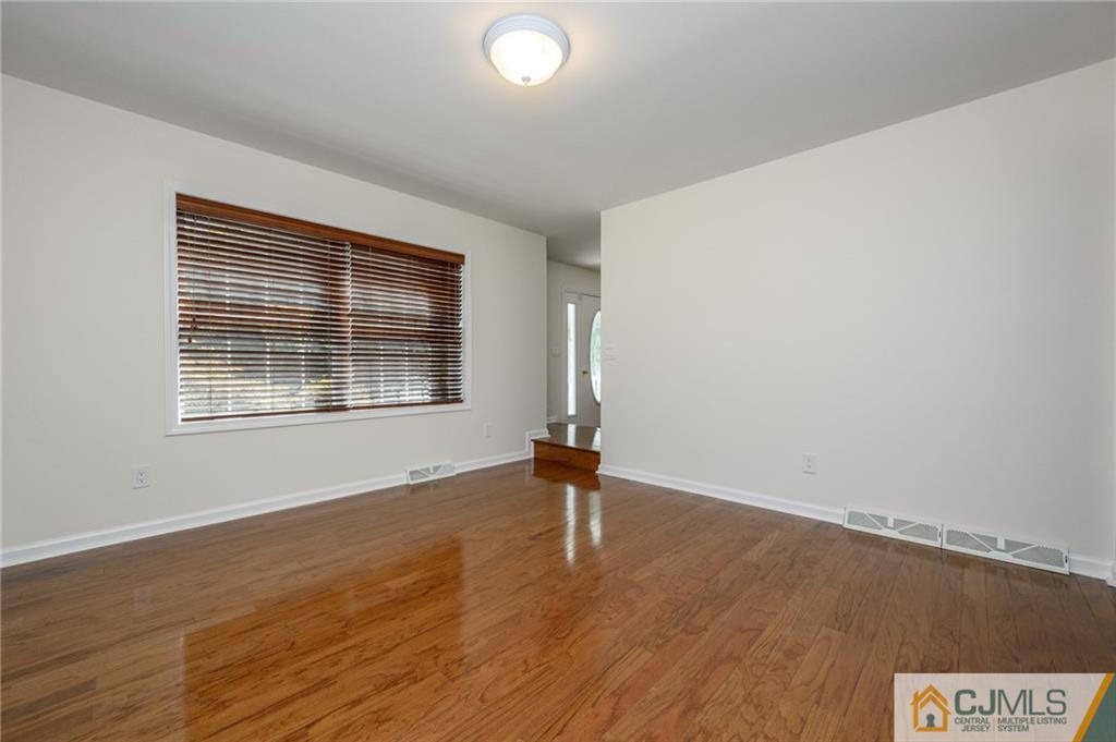 20 Blue Jay Hill Road Westampton, NJ 08060 - Photo 10 of 65 a view of an empty room with wooden floor and a window