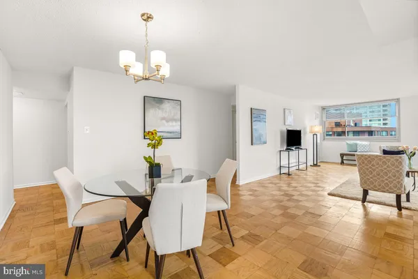 a view of a dining room with furniture and wooden floor
