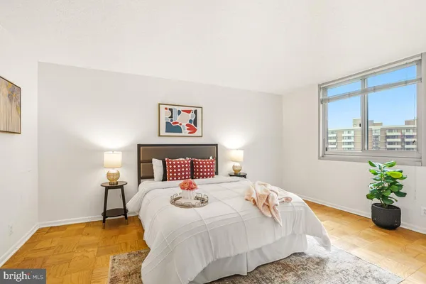 a bedroom with a bed and a couch