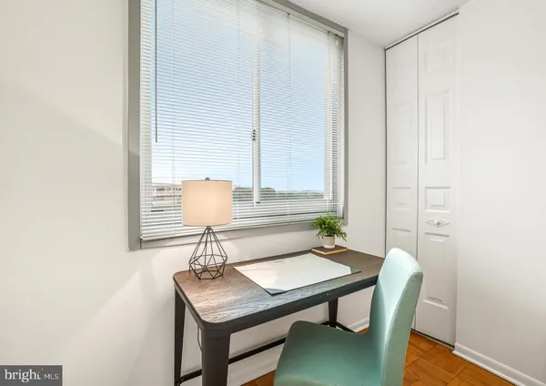 a view of a workspace with furniture