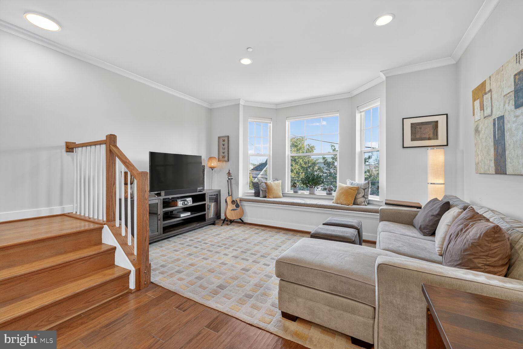3328 7th Street Northeast Washington, DC 20017 - Photo 11 of 30 a living room with furniture a flat screen tv and a large window