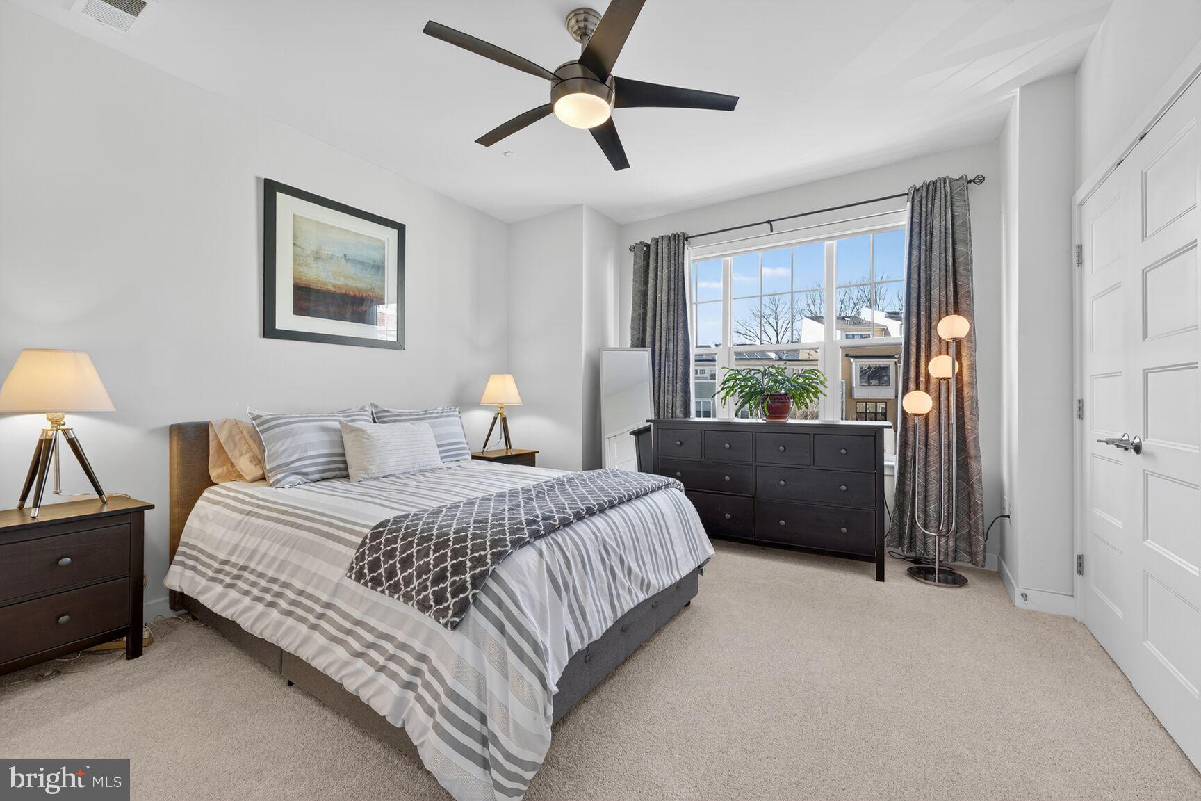 3328 7th Street Northeast Washington, DC 20017 - Photo 12 of 30 a bedroom with a bed and a chandelier