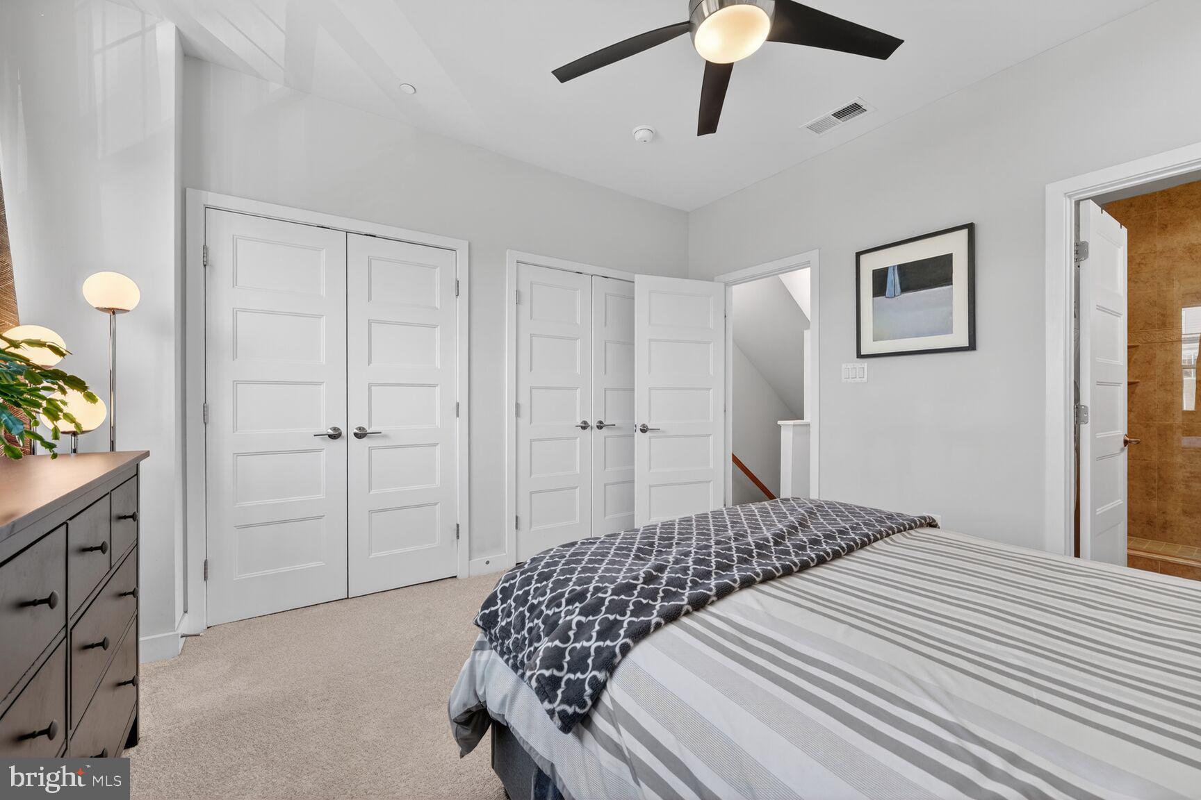 3328 7th Street Northeast Washington, DC 20017 - Photo 13 of 30 a bedroom with a bed and a chandelier