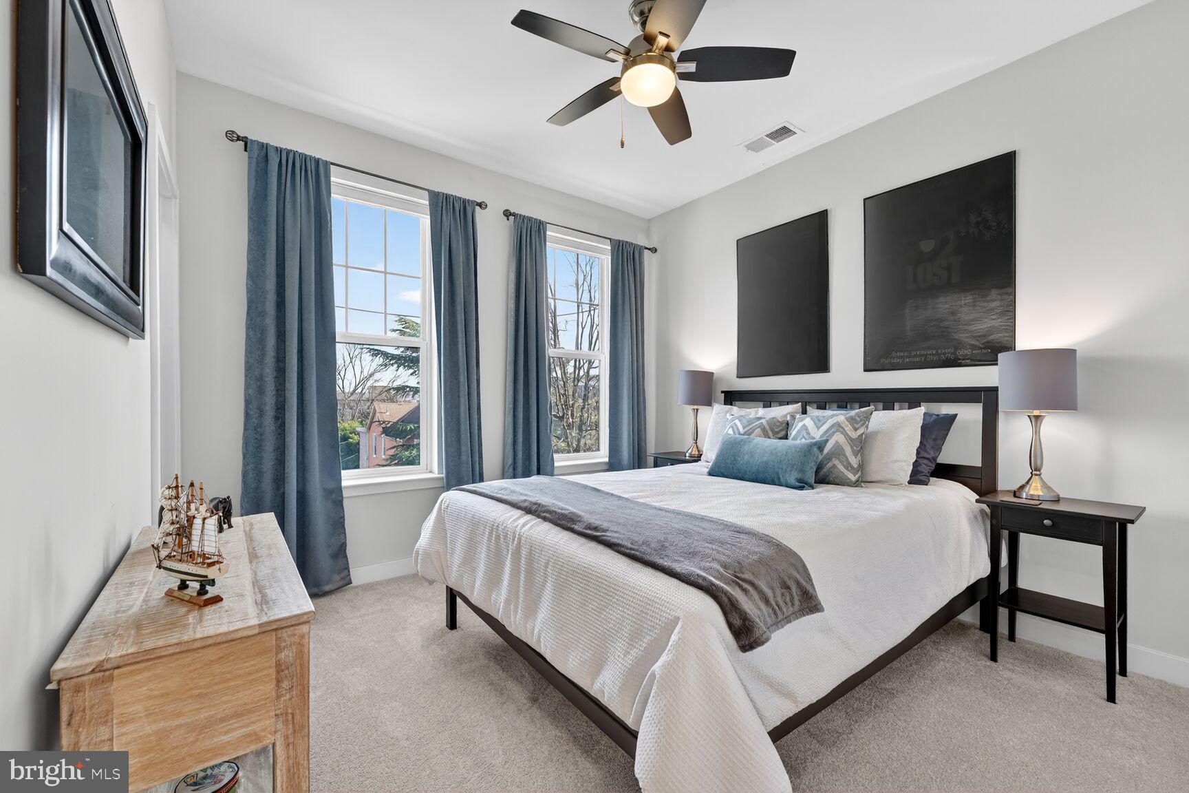 3328 7th Street Northeast Washington, DC 20017 - Photo 15 of 30 a bedroom with a bed and glass window