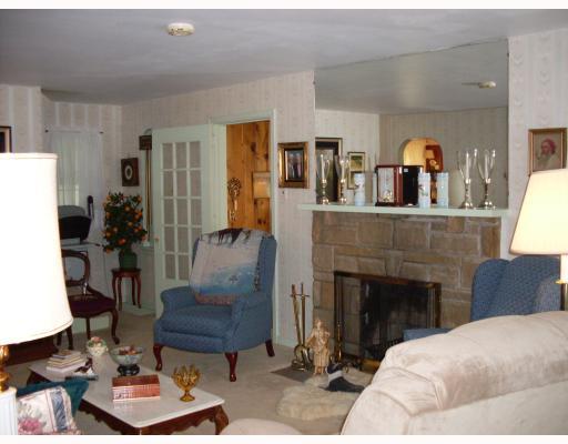 555 Franklin Farms Road Washington, PA 15301 - Photo 2 of 13 Living Room. Warm Livingroom with log burning stone fireplace.