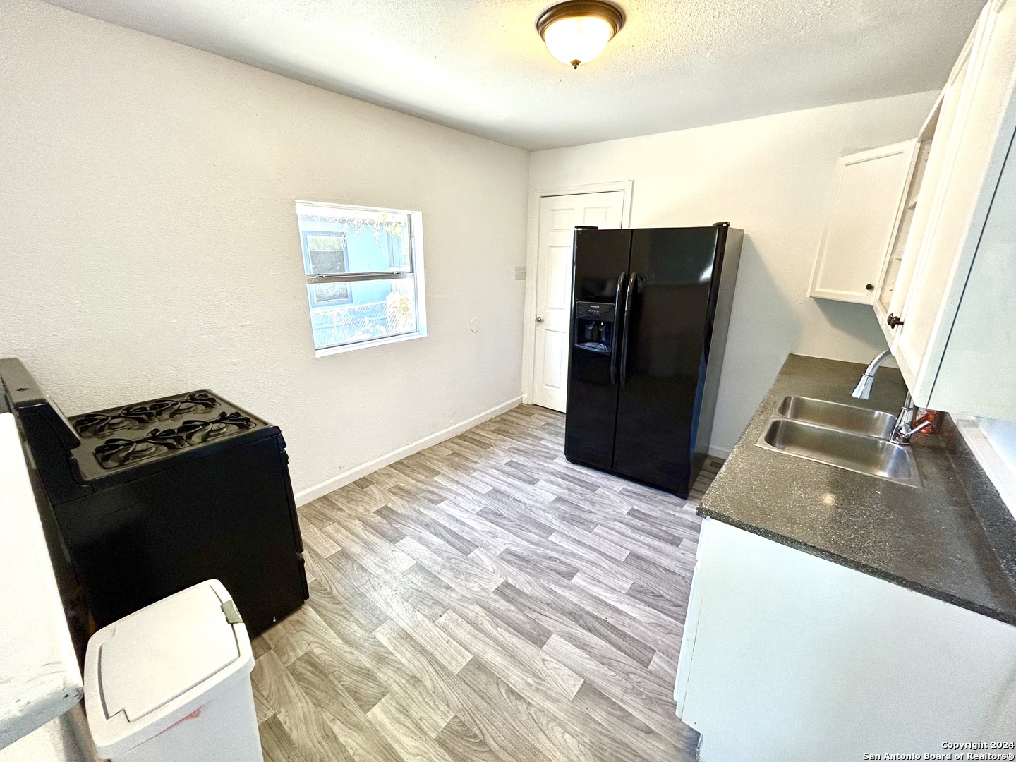 3539 Rivas Street San Antonio, TX 78228 - Photo 5 of 15 a black and white checkered floor
