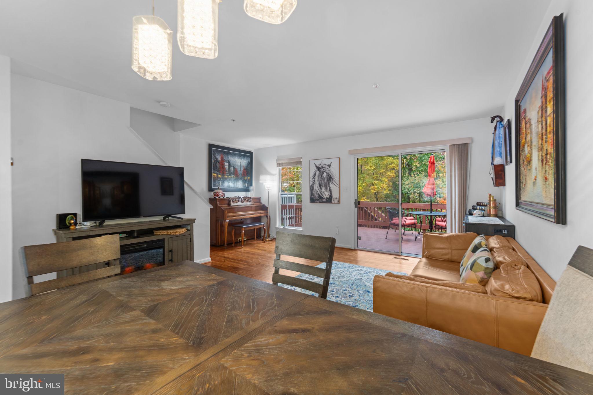 12705 Hawkshead Terrace Silver Spring, MD 20904 - Photo 16 of 52 a living room with furniture and a flat screen tv