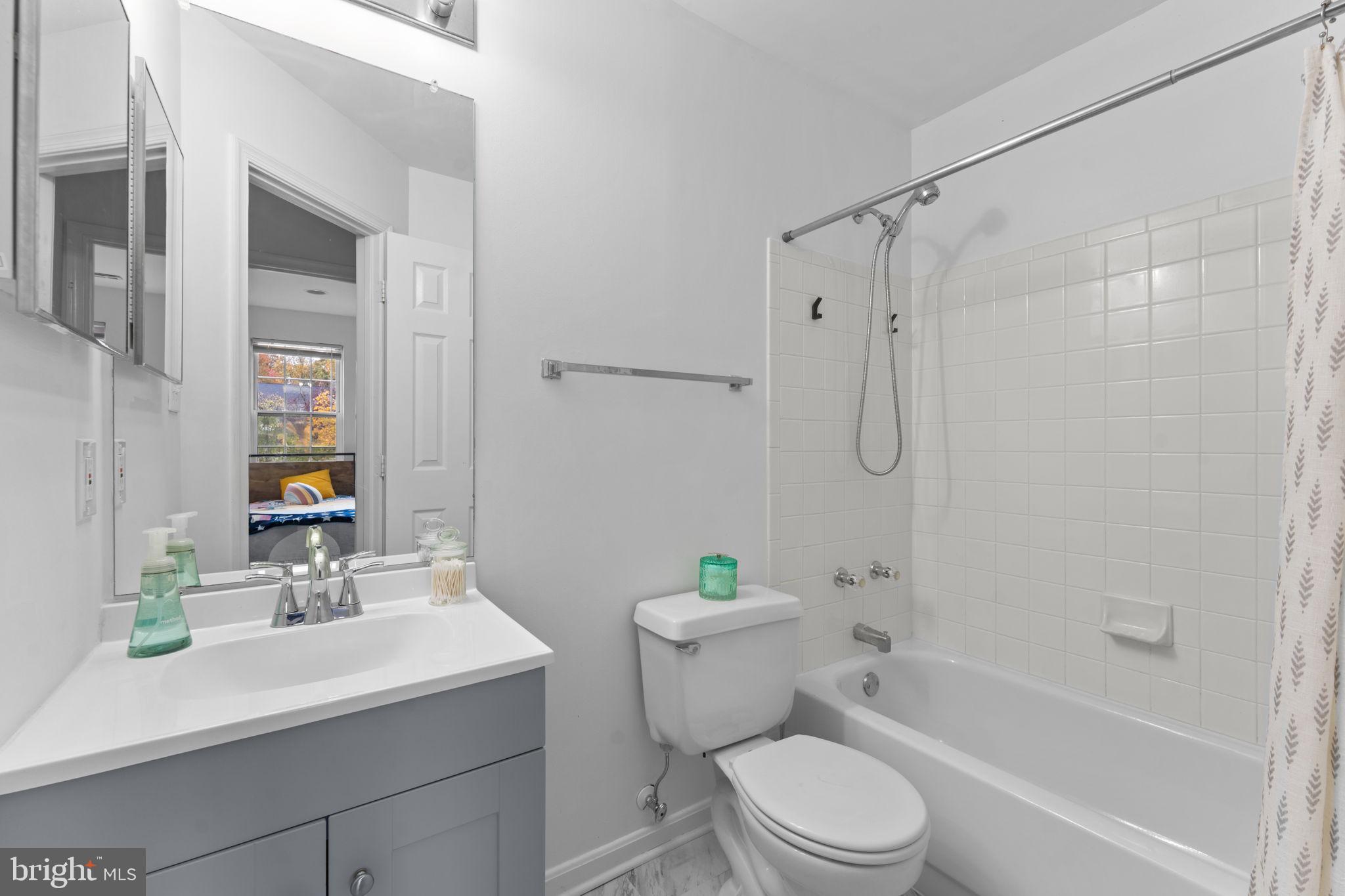 12705 Hawkshead Terrace Silver Spring, MD 20904 - Photo 30 of 52 a bathroom with a sink a toilet and shower