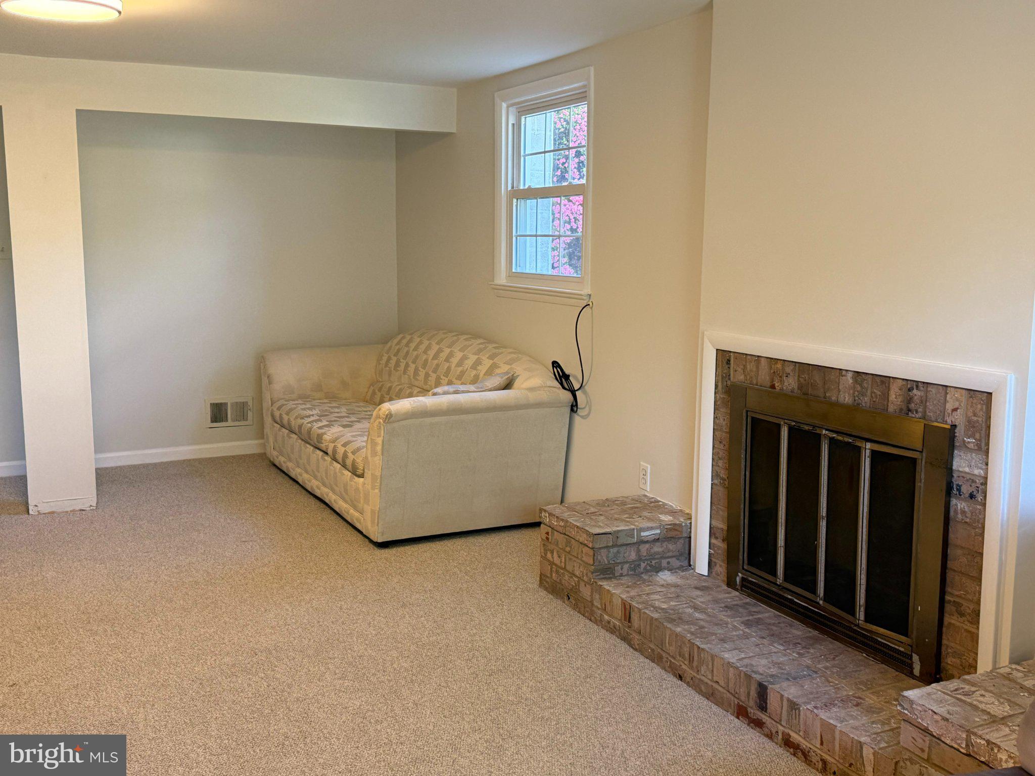 1009 Broadmore Circle Silver Spring, MD 20904 - Photo 13 of 46 Cozy living space with a fireplace.