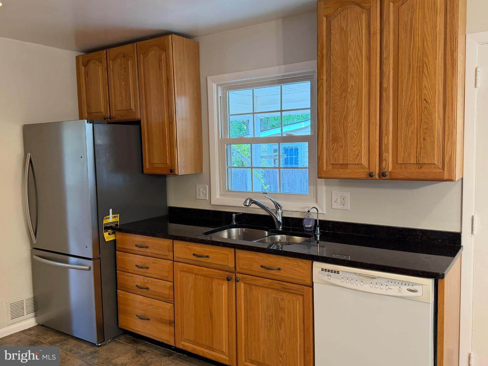 1009 Broadmore Circle Silver Spring, MD 20904 - Photo 20 of 46 Modern kitchen with warm wood tones.