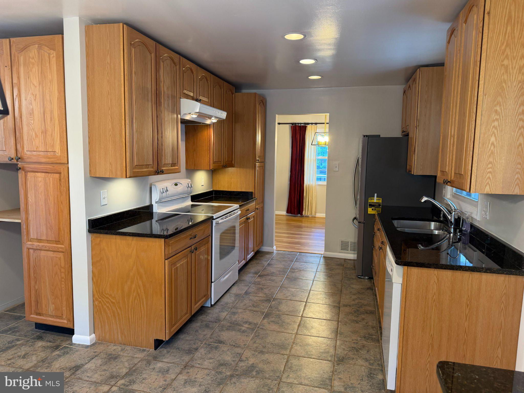 1009 Broadmore Circle Silver Spring, MD 20904 - Photo 33 of 46 Modern kitchen with warm wood tones.