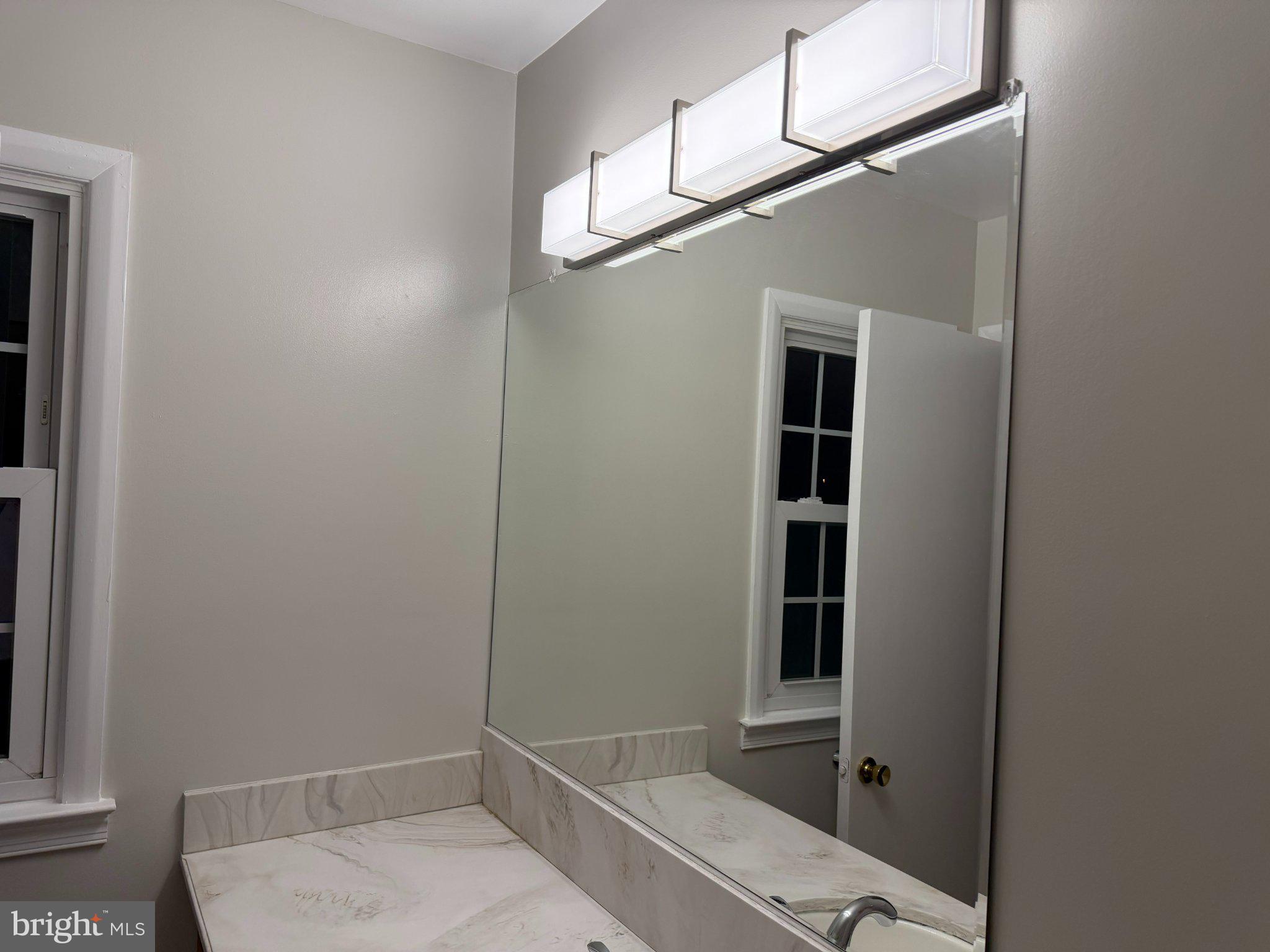 1009 Broadmore Circle Silver Spring, MD 20904 - Photo 5 of 46 Sleek modern bathroom with natural light.