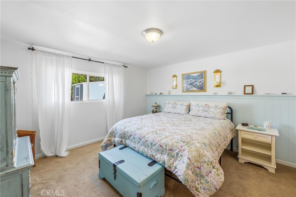 11 E Crescent Redlands, CA 92373 - Photo 20 of 35 a bedroom with a bed and a window