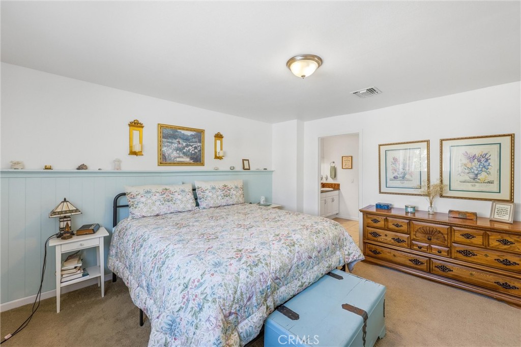 11 E Crescent Redlands, CA 92373 - Photo 22 of 35 a bedroom with a bed and wooden floor