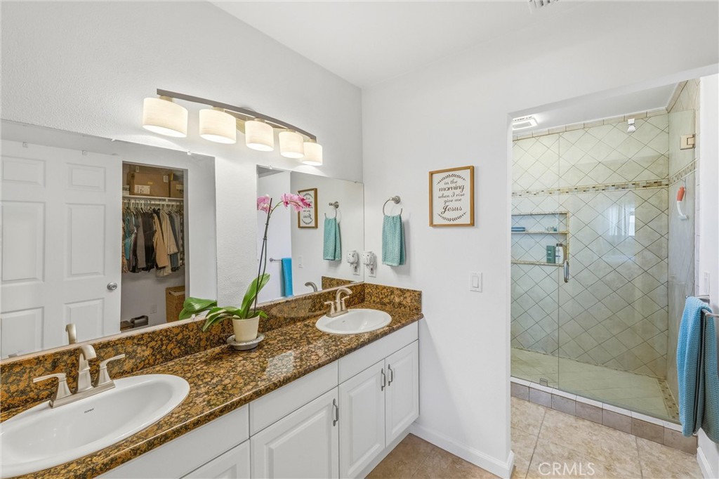 11 E Crescent Redlands, CA 92373 - Photo 23 of 35 a bathroom with a granite countertop sink mirror and shower