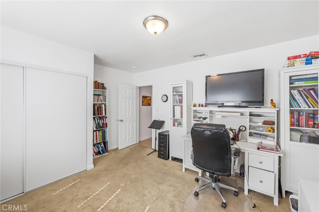 11 E Crescent Redlands, CA 92373 - Photo 26 of 35 a view of a workspace with furniture and a window