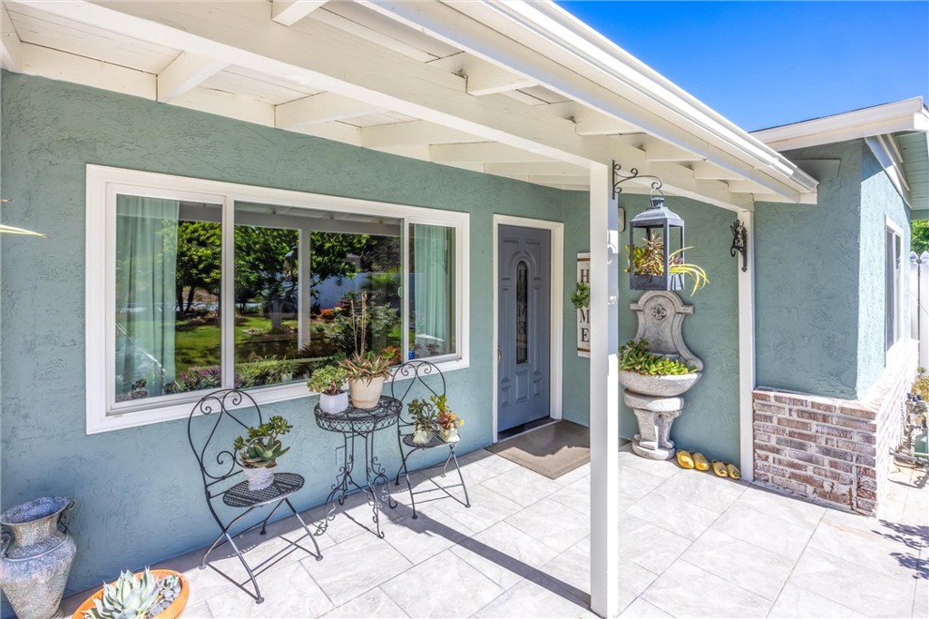11 E Crescent Redlands, CA 92373 - Photo 3 of 35 a view of a patio with table and chairs and potted plants