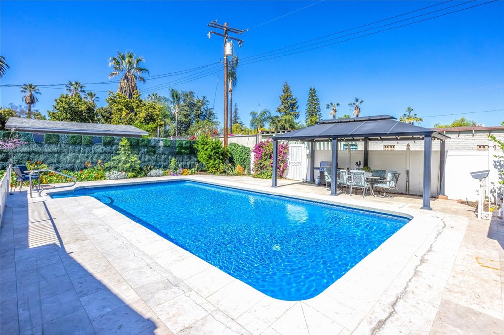 11 E Crescent Redlands, CA 92373 - Photo 31 of 35 a view of swimming pool with outdoor seating and city view