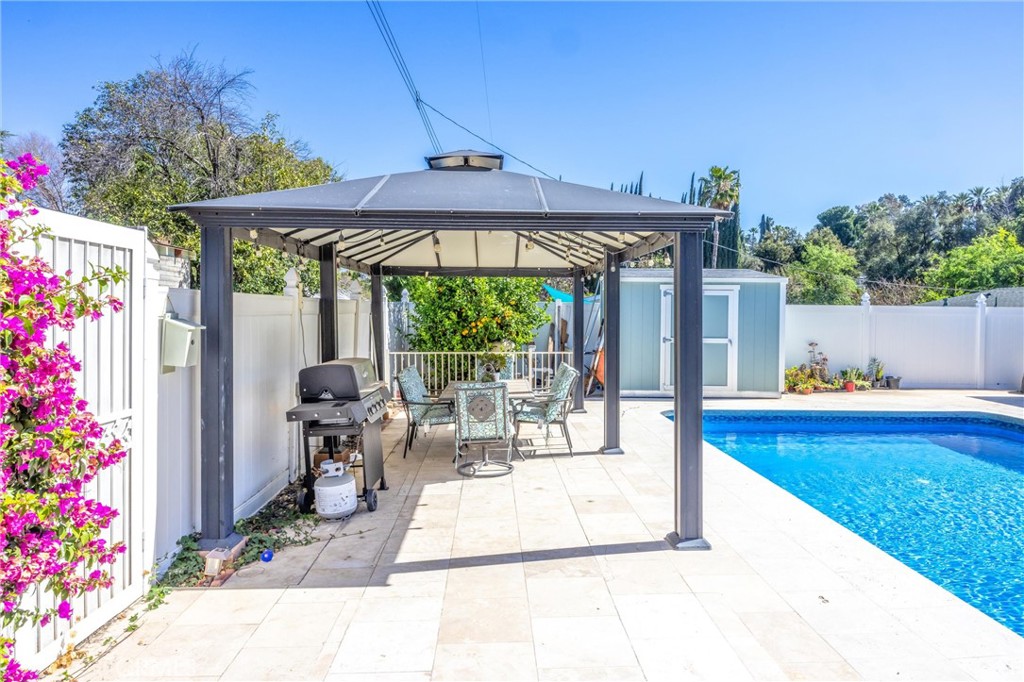 11 E Crescent Redlands, CA 92373 - Photo 34 of 35 a view of a patio with a table and chairs under an umbrella