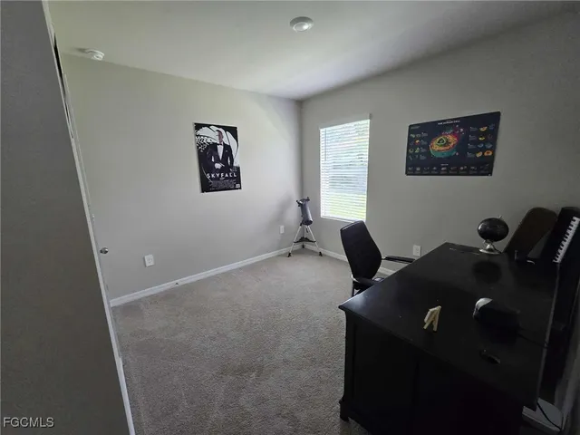 a workspace with furniture and window