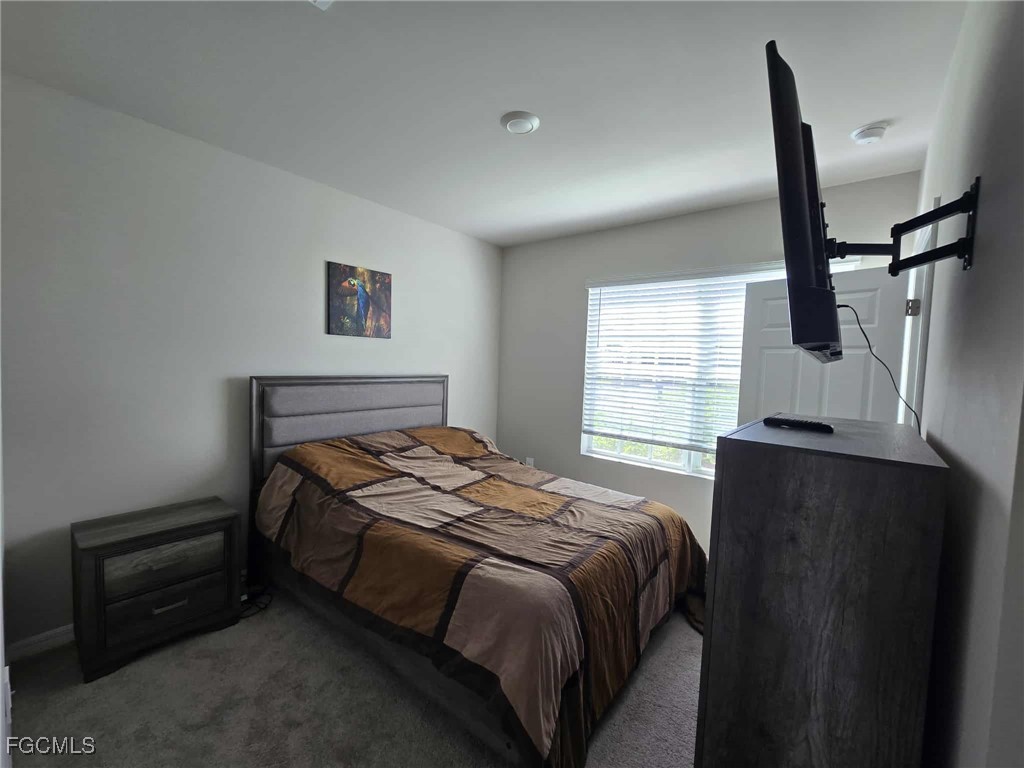 Undisclosed Address Punta Gorda, FL 33955 - Photo 16 of 17 a bedroom with a bed and a window