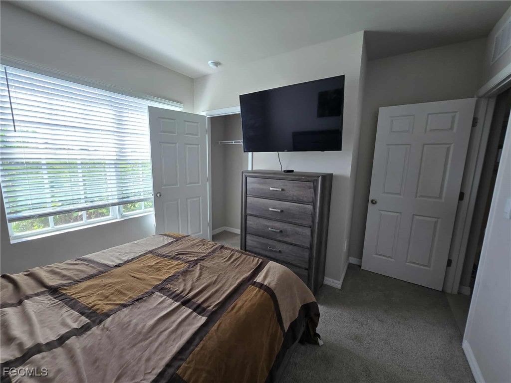 Undisclosed Address Punta Gorda, FL 33955 - Photo 17 of 17 a bedroom with a bed and a flat screen tv