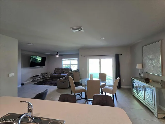 a view of a livingroom with furniture window and wooden floor