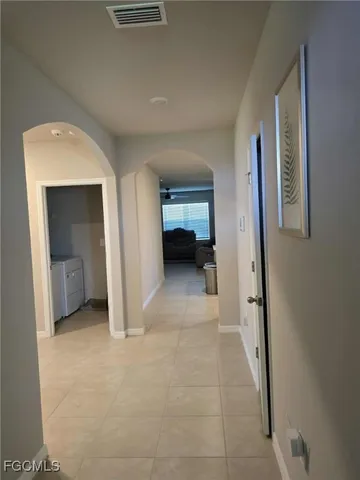 a view of a room with a hallway