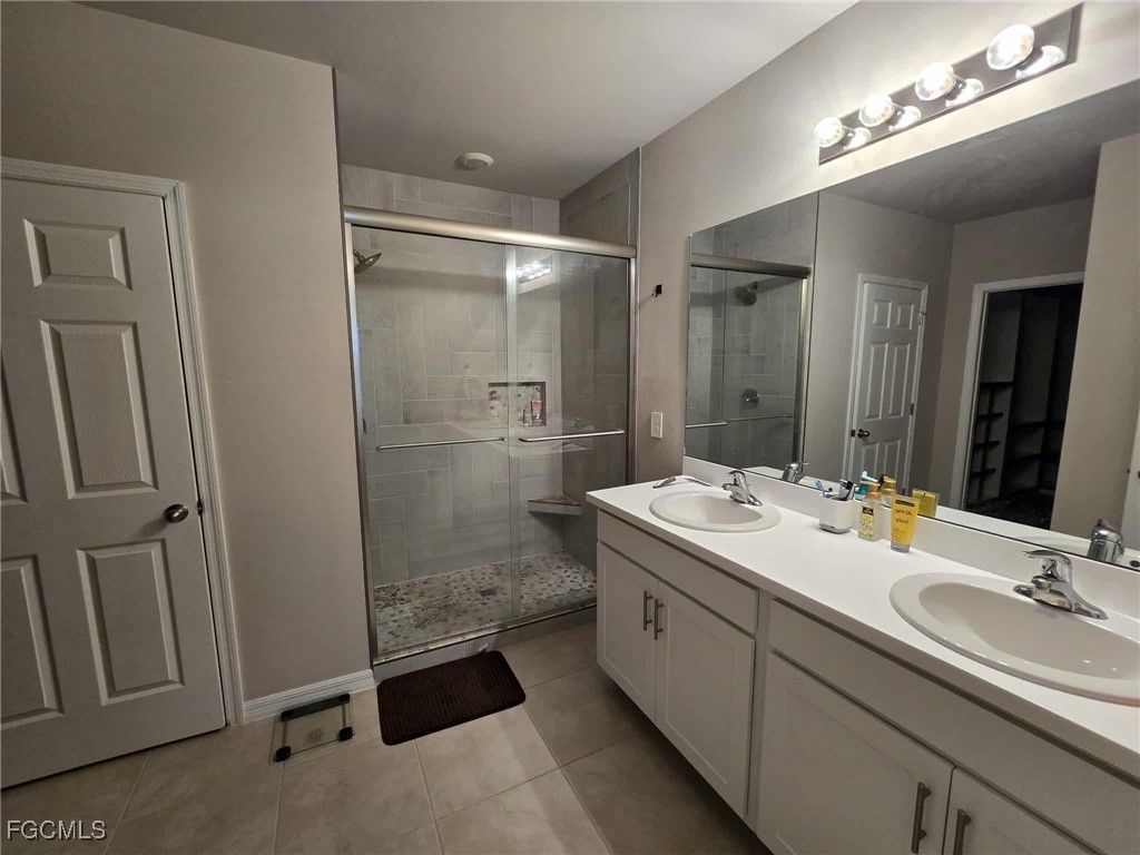 Undisclosed Address Punta Gorda, FL 33955 - Photo 10 of 17 a bathroom with a sink double vanity and a mirror