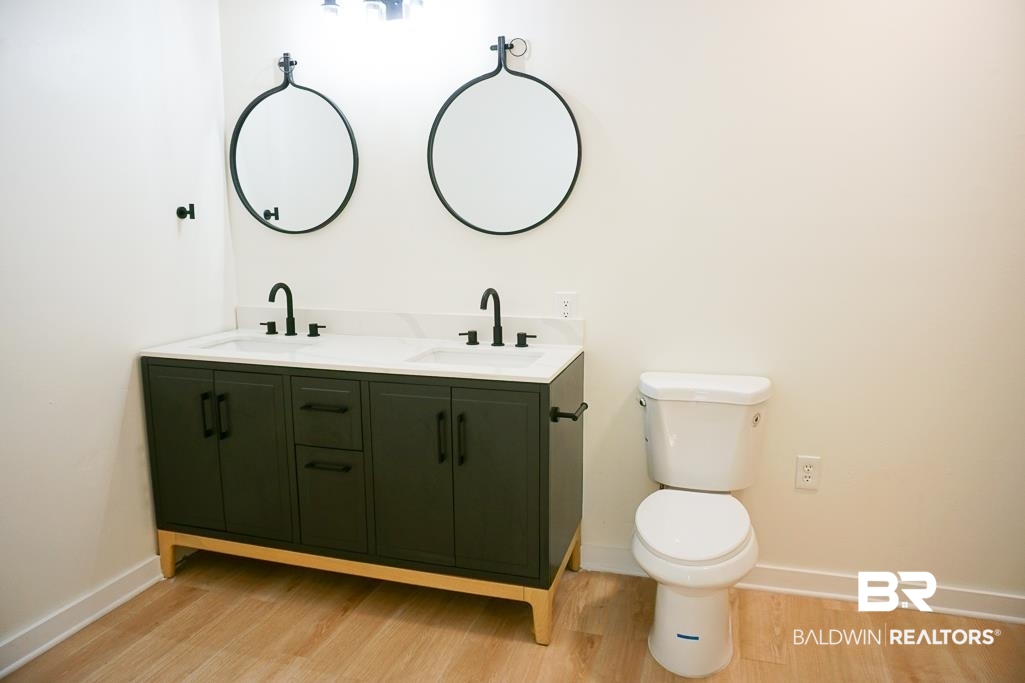 4667 Cottonwood Drive Mobile, AL 36608 - Photo 14 of 21 Bathroom with vanity, wood-type flooring, and toilet