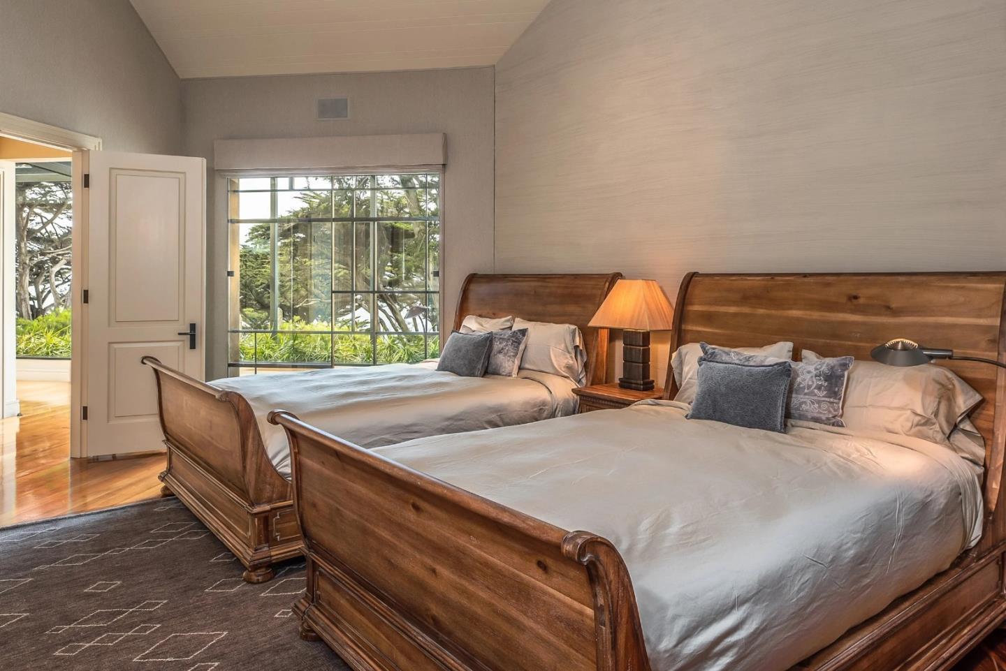 157-163 Spindrift Road Carmel, CA 93923 - Photo 63 of 100 a bedroom with two beds and wooden floor