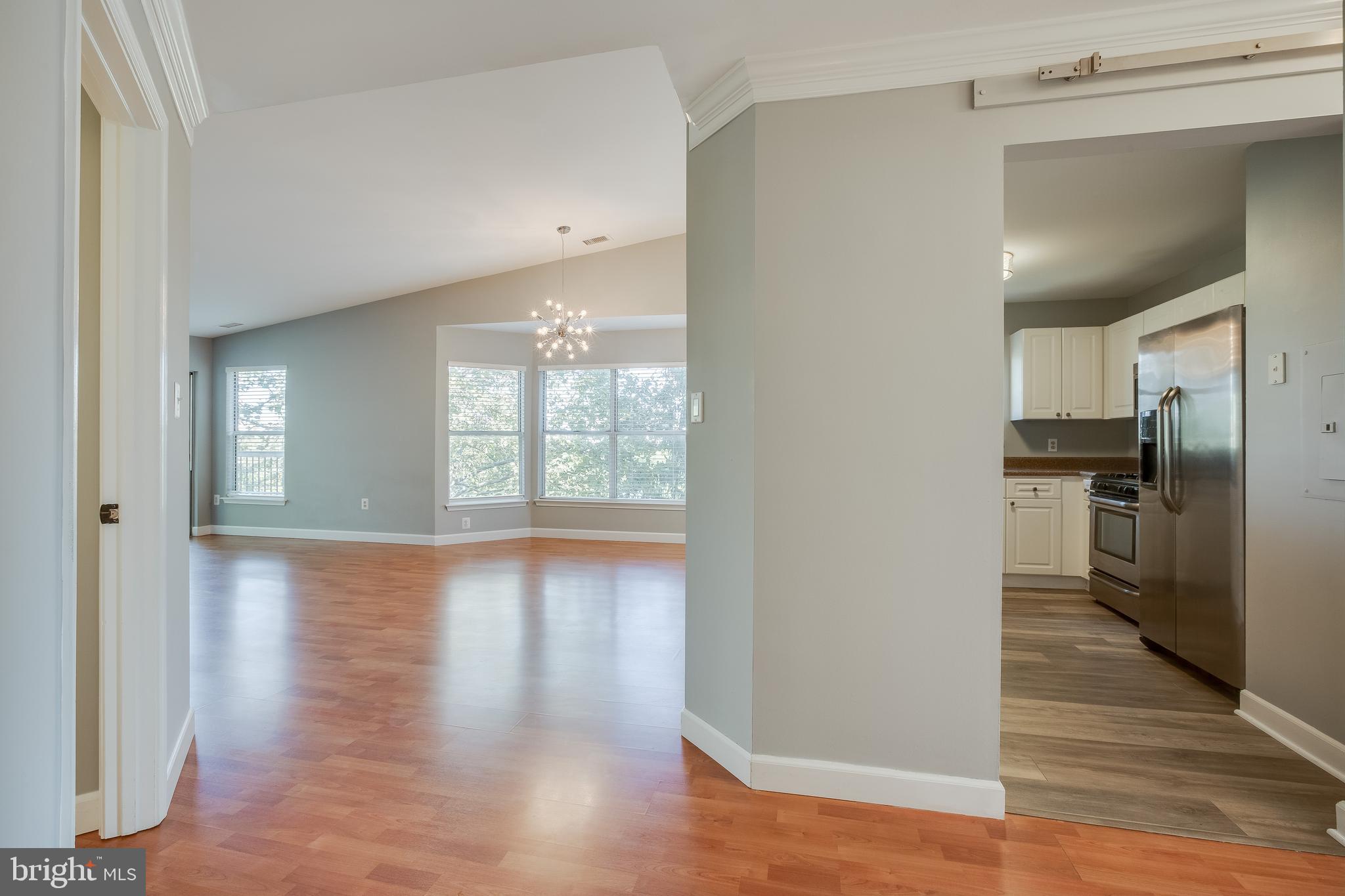 20575 Snowshoe Square, Unit 302 Ashburn, VA 20147 - Photo 2 of 32 a view of a kitchen with a sink and a window