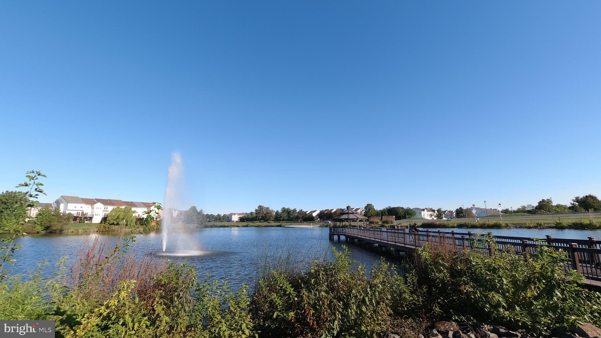 20575 Snowshoe Square, Unit 302 Ashburn, VA 20147 - Photo 30 of 32 a view of a lake with houses